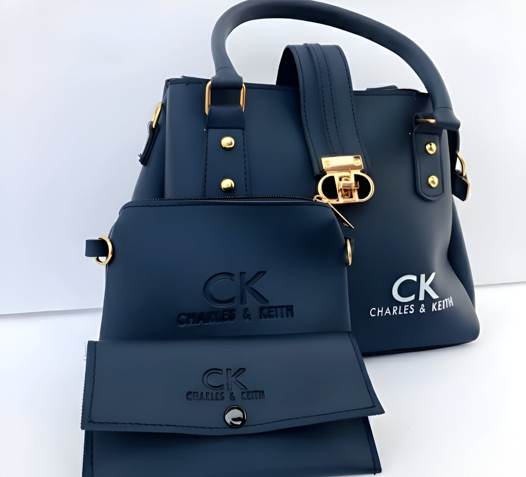 Stylish 3 piece navy blue handbag with clutch and wallet. Featuring "Charles & Keith CK" branding.