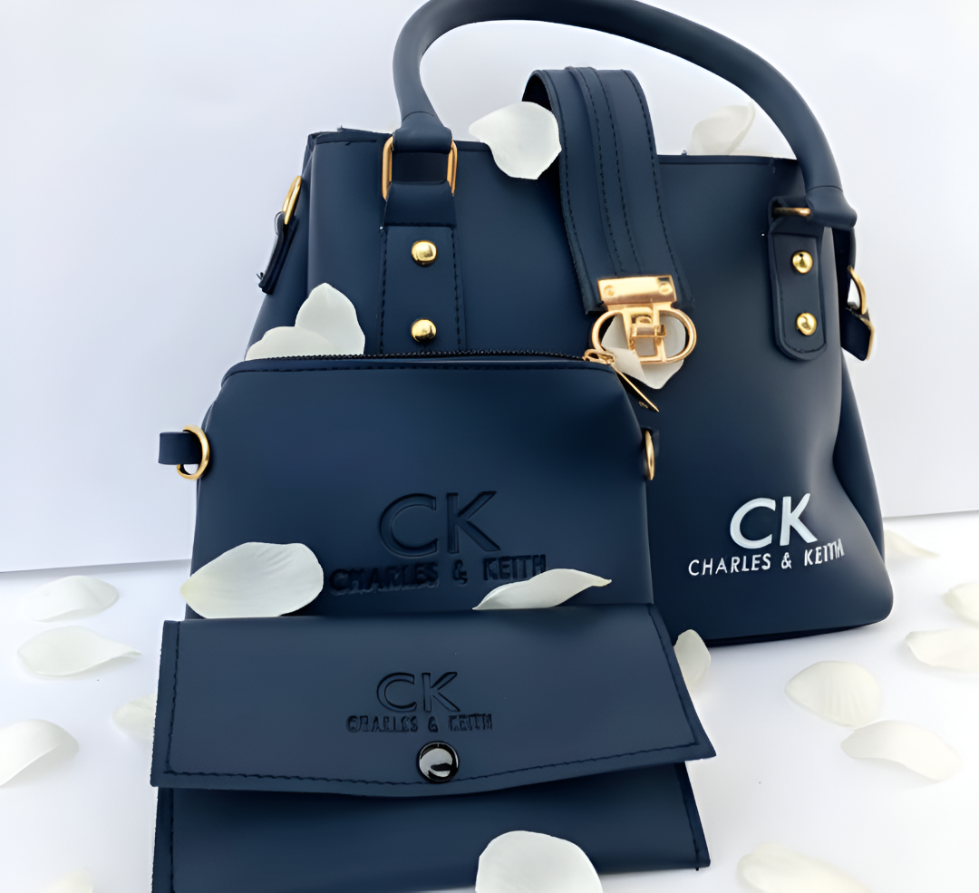 A 3 piece dark blue handbag, wallet, and clutch from "CK CHARLES & KEITH".