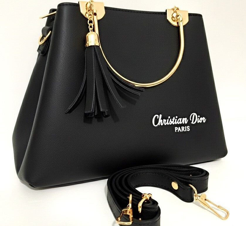 Luxury black handbag for ladies with tassels and gold handles. "Christian Dior Paris" logo in white.