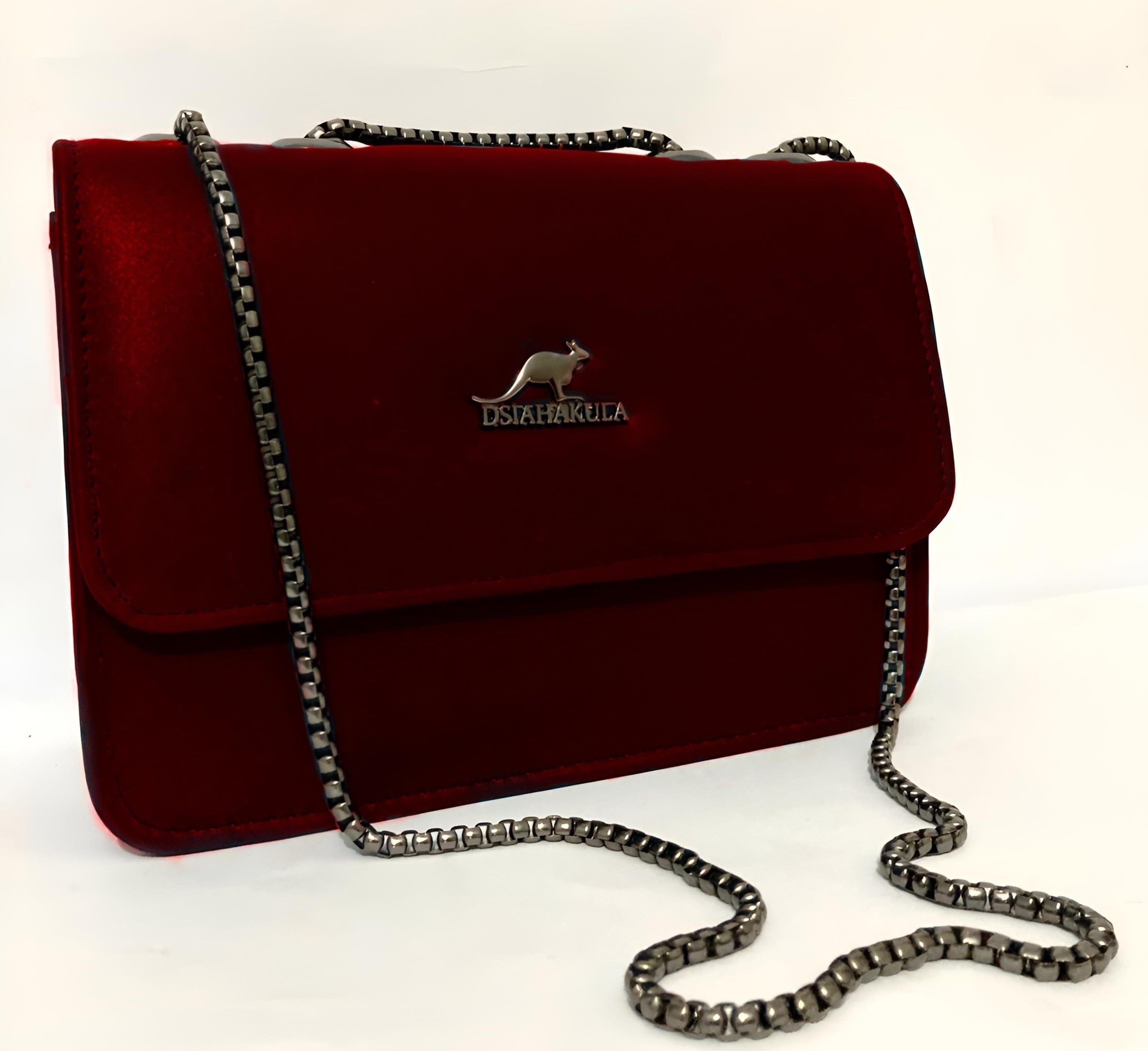 Maroon DSIAHAKULA handbag with a chain strap on a white background