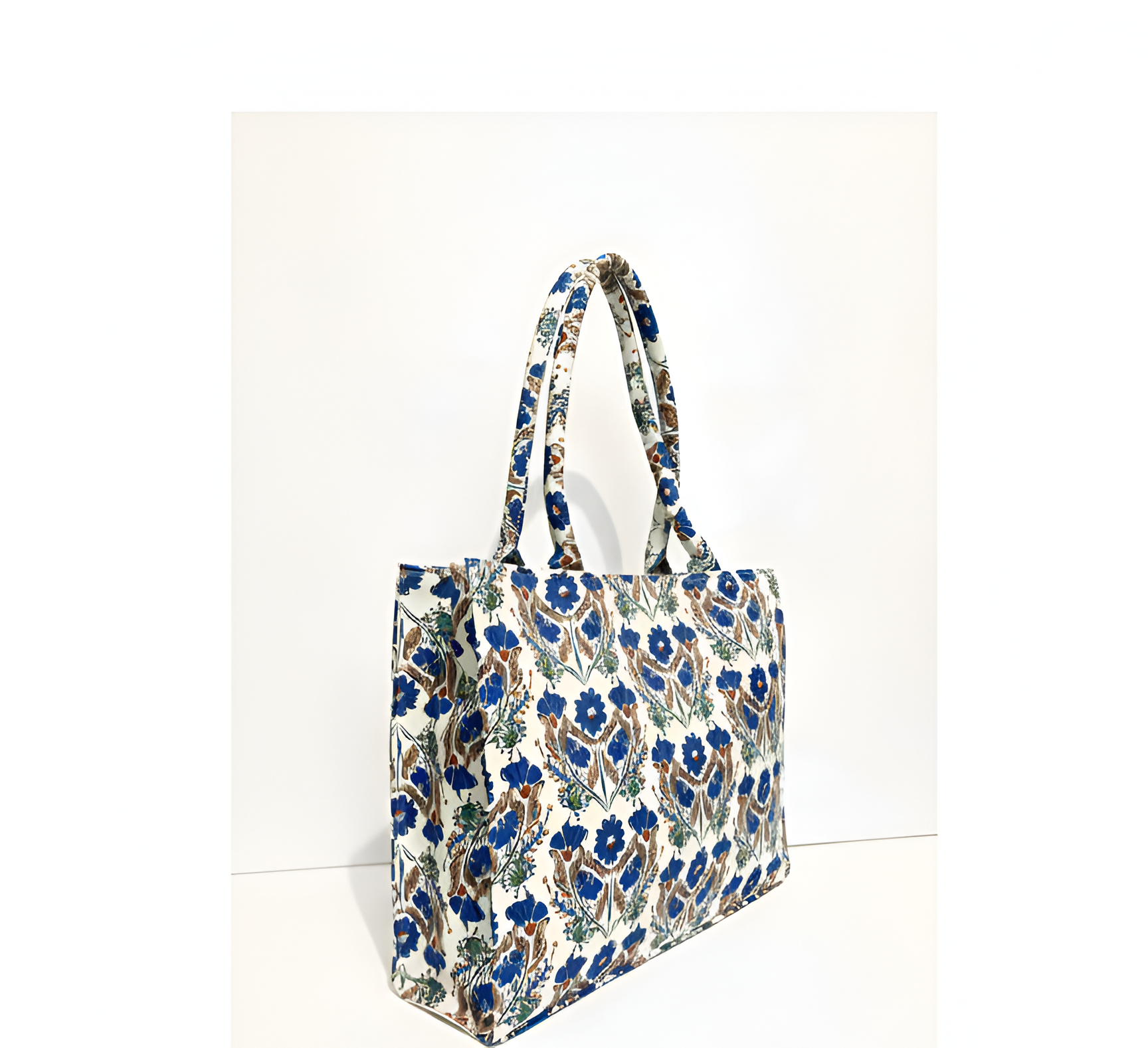 A canvas tote bag featuring a vibrant floral pattern, suitable for various occasions and styled as a fashionable accessory.