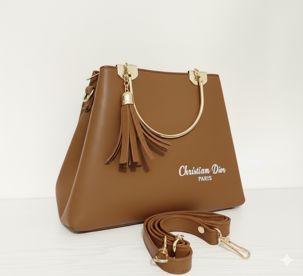 Elegant and stylish brown "Christian Dior Paris" handbag with matching strap and gold handles.